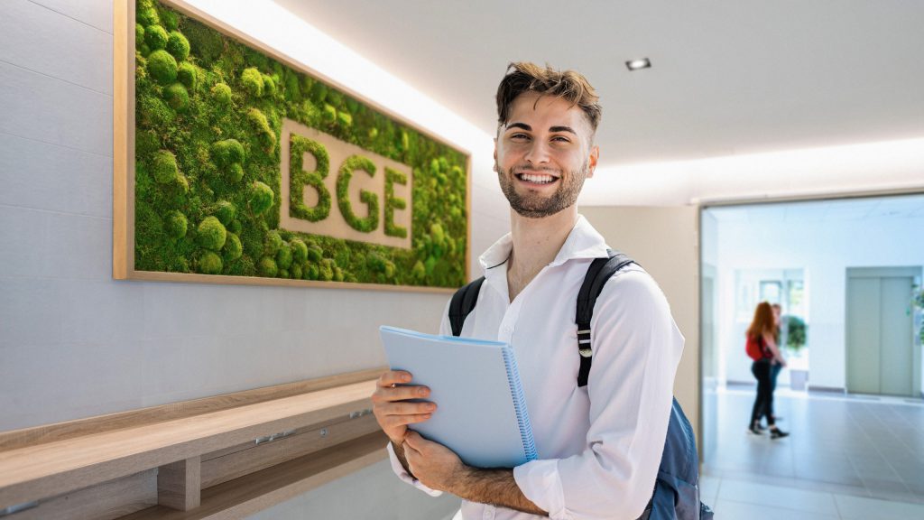 Master's programmes - Guy standing and smiling