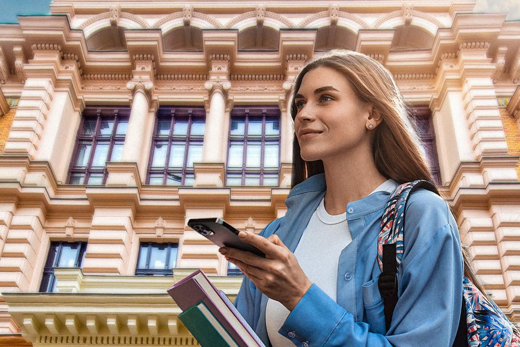 Master's programmes Stock photo - Girl walking in front of the University